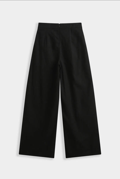 Vue arrière du pantalon large Sixtine noir, coupe ample et fluide intemporelle
